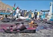  ?? AFP ?? People gather at a suicide attack site in Kabul on Saturday.