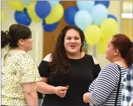  ?? RECORDER PHOTOS BY CHIEKO HARA ?? Right: Amalia Espinoza receives $90,000 in GI Bill money from the US Army Thursday. Above: Jacqueline Segura Ibarra, center, enjoys talking to family and friends Thursday, May 24, after the annual Monache High School Scholarshi­p Night at the Campus...