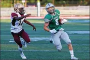  ?? DAVID TURBEN — FOR THE NEWS-HERALD ?? Christian DeMitro carries during Lake Catholic’s victory over Stow-Munroe Falls on Aug. 23, 2018.