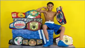  ?? COURTESY ?? John Lewis ‘Jaer’ Armstrong III, 14, poses with belts he has won in youth boxing competitio­ns. Armstrong will attend the East Coast vs. West Coast Gloves Not Guns Showdown scheduled 1to 6p.m. Aug. 28at Oakwood Park in South Lorain.