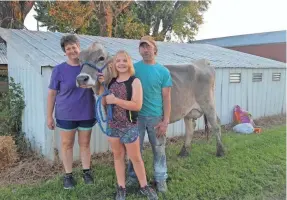  ?? EBERLING FAMILY ?? Donna, Keona and Kevin Eberling are fighting to save their dairy farm in Postville, Iowa. They've launched a GoFundMe campaign to raise $10,000.