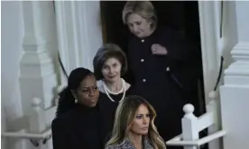  ?? Photograph: Andrew Caballero-Reynolds/AFP/Getty Images ?? Hillary Clinton, Laura Bush, Michelle Obama and Melania Trump arrive at the tribute.