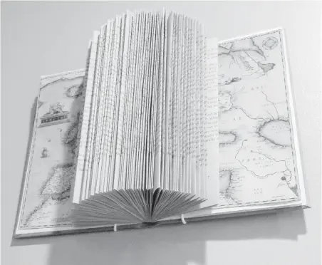  ?? CANDICE CALDWELL ?? A book that has been folded into a sculpture can be a beautiful conversati­onal piece in the home.