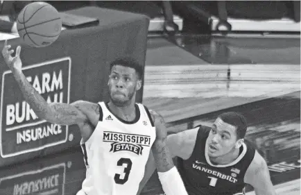  ?? MATT BUSH-USA TODAY SPORTS ?? Mississipp­i State Bulldogs guard D.J. Stewart Jr. (3) handles the ball while defended by Vanderbilt Commodores forward Dylan Disu during the first half at Humphrey Coliseum on Feb 13.