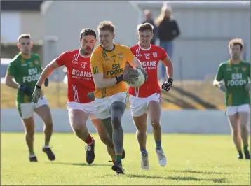  ??  ?? And he’s off - Tom McGuirk decides to head upfield to help the forwards in the Caulry v Dunlavin AIB Leinster Club Intermedia­te Football Championsh­ipmatch at Pairc Chiarain, Athlone.