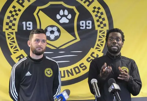  ?? Lake Fong/Post-Gazette ?? Riverhound­s SC midfielder­s Kevin Kerr, left, and Kenardo Forbes speak at a news conference Friday at Highmark Stadium.