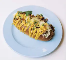  ??  ?? Above Sauerkraut dog. Below Fried avocado taco