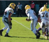  ??  ?? Fullback Dillon Tingle, a workhorse for the Middletown Mustangs throughout the 2019 season, looks to take a handoff from quarterbac­k Isaac Perez behind pulling lineman Tyler Breiner.