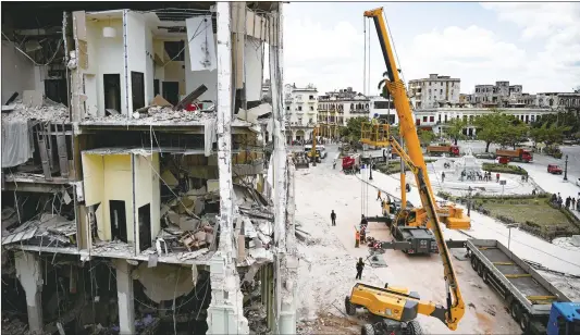  ?? Photo: AFP ?? A crane removes debris from the ruins of the Saratoga Hotel in Havana, Cuba on May 7, 2022.