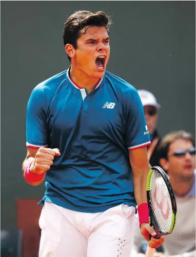  ?? GETTY IMAGES ?? Canada’s Milos Raonic reacts after making a shot during his Round 4 match against Pablo Carreno Busta Sunday at the French Open. Roanic lost in five sets.