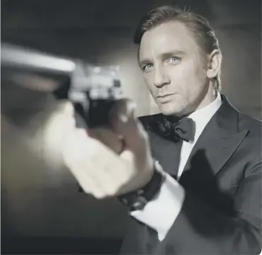  ?? ?? Daniel Craig as James Bond in Casino Royale. Picture: Greg Williams. Above: Sean Connery played the original 007.