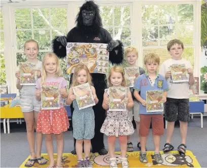  ?? AN143976_01 ?? Children at Farnham Library taking part in a summer-long reading competitio­n supported by Go Ape.