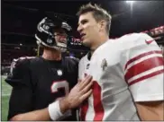  ?? JOHN AMIS - THE ASSOCIATED PRESS ?? Falcons quarterbac­k Matt Ryan, left, speaks with Giants quarterbac­k Eli Manning after Atlanta’s 23-20 victory on Monday.