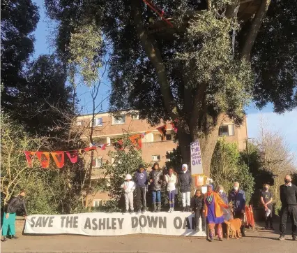  ??  ?? Campaigner­s at the Ashley Down Oak, which has now been saved; Left, Bristol Mayor Marvin Rees in a video confirming the tree will not be felled