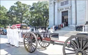  ?? AFP ?? Navy pallbearer­s place late John McCain’s casket onto a horse-drawn carriage after his funeral service at the United States Naval Academy Chapel on Sunday.