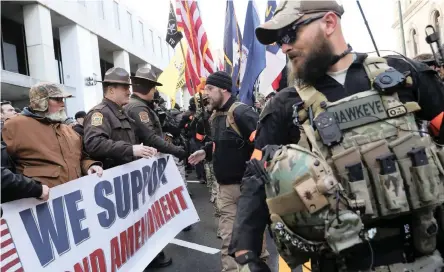  ?? | Reuters ?? PRO-gun activists take part in a rally against the Virginia Democrats’ plan to pass gun legislatio­n, at the Virginia State Capitol building, in Richmond, yesterday.