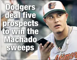  ?? Getty Images ?? PICTURE THIS: Manny Machado gets his phone out for photos during the All-Star Game, his final one in an Orioles uniform before being traded to the Dodgers on Wednesday.