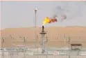 ?? — Reuters ?? Flames are seen at the production facility of Saudi Aramco’s Shaybah oilfield in the Empty Quarter, Saudi Arabia.