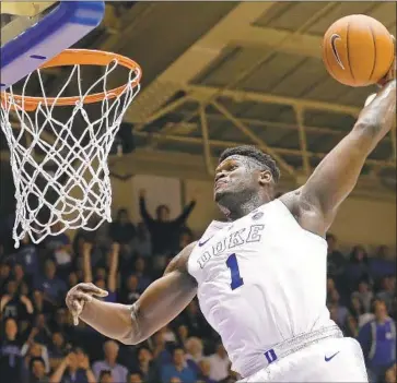  ?? Gerry Broome Associated Press ?? ZION WILLIAMSON was a soaring sensation in his one season at Duke and is expected to be the No. 1 overall pick in Thursday’s NBA draft by the Pelicans. How the rest of the first round plays out is far less certain.