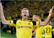  ?? — AFP ?? Dortmund midfielder Andre Schuerrle celebrates scoring his side’s second goal on Tuesday.