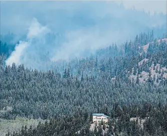  ?? DARRYL DYCK
THE CANADIAN PRESS ?? The Shovel Lake wildfire burns on a mountain behind a home near Fort Fraser, B.C., a few days ago. This year’s wildfire season is already the second worst in British Columbia’s history.