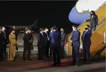  ?? AP ?? HAVANA SYNDROME? Vice President Kamala Harris is greeted by Vietnamese officials on arrival Tuesday in Hanoi. Her visit was delayed by two incidents that may be caused by a loud, piercing sound — similar incidents have been reported by U.S. diplomats around the world.