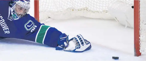  ?? DARRYL DYCK/THE CANADIAN PRESS ?? Canucks goalie Ryan Miller watches helplessly as the puck heads toward the net on one of Brad Marchand’s three goals Monday at Rogers Arena.