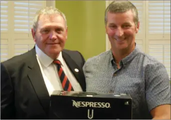  ??  ?? Seamus Reilly receives the winner’s prize for the first qualifying day in the 2018 Captain’s Prize from County Louth Club Captain Pat McCabe.