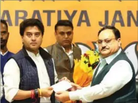  ??  ?? Jyotiradit­ya Scindia and JP Nadda at the BJP headquarte­rs.