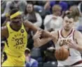 ?? DARRON CUMMINGS — THE ASSOCIATED PRESS ?? The Pacers’ Myles Turner the Cavaliers’ Ante Zizic battle for the ball during the first half Feb. 9 in Indianapol­is.
