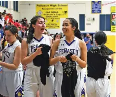  ??  ?? Aguilar, right, walks off the court with fellow senior Carly Gonzales after beating Loving.