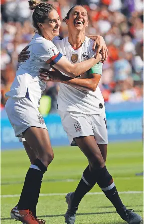  ??  ?? With two Sunday, Carli Lloyd, right, celebratin­g with Morgan Brian, became the first to score goals in six World Cup games in a row. MICHAEL CHOW/USA TODAY