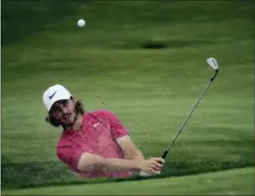  ?? CHARLIE RIEDEL — THE ASSOCIATED PRESS ?? Tommy Fleetwood hits from a bunker on the 15th hole in the third round of the U.S. Open on Saturday.