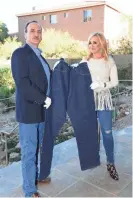  ?? FOX BUSINESS PHOTOS ?? "Strange Inheritanc­e" host Jamie Colby and Daniel Soules, an Americana appraiser, show off a 124-year-old pair of blue jeans.