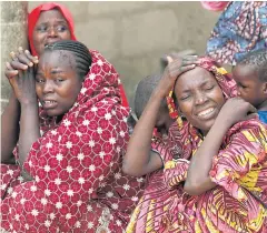  ??  ?? NATIONAL DISASTER: Relatives of the missing schoolgirl­s react in Dapchi in the northeaste­rn state of Yobe, after an attack on the village by Boko Haram.