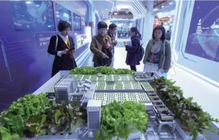  ??  ?? The model of an intelligen­t vegetable factory is on display at the Zhejiang Agricultur­al Fair in Hangzhou, capital of
Zhejiang Province in east China, on November 22, 2019