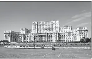  ?? Rick Steves’ Europe/CAMERON HEWITT ?? Bucharest’s Palace of the Parliament — the largest building in Europe — is a monument to one dictator’s megalomani­a.