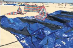  ??  ?? TRAGEDY Trampoline lies deflated on beach after explosion yesterday
