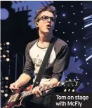  ??  ?? Tom on stage with McFly