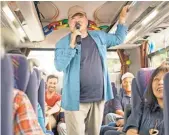  ??  ?? Shatner trades his communicat­or for a mike as he shows off his karaoke skills on a bus trip in Japan.