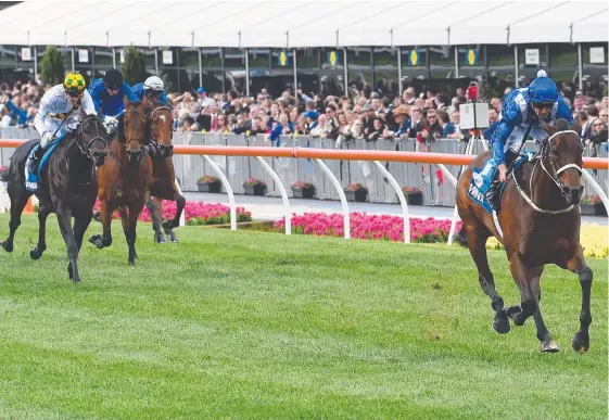  ?? Picture: GETTY IMAGES ?? Winx clears out to defeat Hartnell and Yankee Rose at Moonee Valley in the spring to claim her second successive Cox Plate.