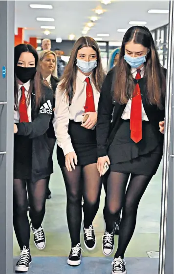 ??  ?? Pupils return to St Paul’s High School in Glasgow yesterday for the first time since the start of the coronaviru­s lockdown nearly five months ago, with more returning today, as the fallout continues from the Scottish government’s decision to upgrade exam results