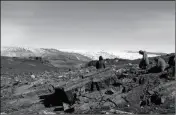  ?? LAURE GAUTHIEZ/THE AUSTRALIAN NATIONAL UNIVERSITY VIA AP ?? IN THIS JULY 2012 PHOTO provided by Laure Gauthiez, scientists Vickie Bennett, Allen Nutman and Clark Friend examine rocks in Greenland.