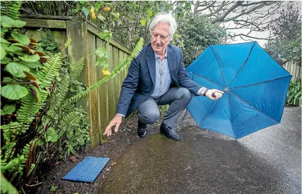  ?? PHOTO’’ GRANT MATTHEW/STUFF ?? New Plymouth District councillor Richard Handley is the first person to volunteer to have a water meter installed on his property.