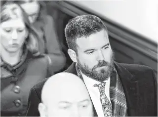  ?? ERIC WYNNE • THE CHRONICLE HERALD ?? Former Halifax Regional Police officer Gary Basso leaves Halifax provincial court last January after his sentencing on a charge of assault causing bodily harm. The Nova Scotia Court of Appeal quashed the conviction Monday and ordered a new trial.