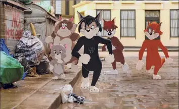  ?? Warner Bros. Pictures via Associated Press ?? Butch, leader of the alley cats, foreground center, in a scene from “Tom & Jerry.” Butch is voiced by Nicky Jam. The animated/live-action film led the way at the weekend’s box office.