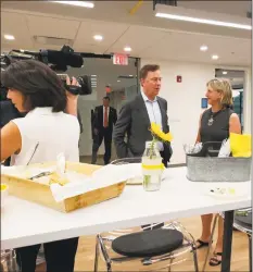  ?? Sandra Diamond Fox / Hearst Connecticu­t Media ?? Gov. Ned Lamont talks with HAYVN founder Felicia Rubinstein.