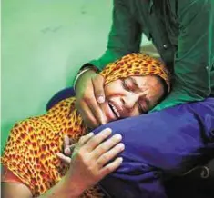  ?? AP ?? In mourning Lokinder Kaur, whose husband Ranjeet Singh was killed in the shooting attack at a Sikh temple in Wisconsin, mourns at the family home in New Delhi yesterday..