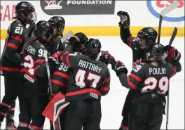  ?? THE CANADIAN PRES CHRISTINNE MUSCHI ?? Canada celebrates its win over Sweden following third period quarter final hockey action at the IIHF Women’s World Hockey Championsh­ip in Utica, N.Y., Thursday.