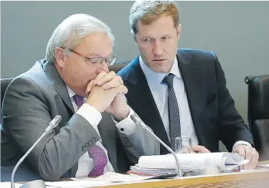  ?? BRUNO FAHY / AFP / GETTY IMAGES ?? Paul Magnette, right, prime minister of the Belgian region of Wallonia, speaks with parliament­ary chairman Andre Antoine, Friday. Magnette said he was open to further talks on CETA, but needed time to review the file.